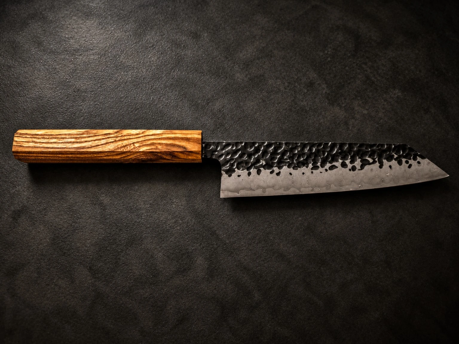 Finished knife — golden figured wood handle with flowing grain