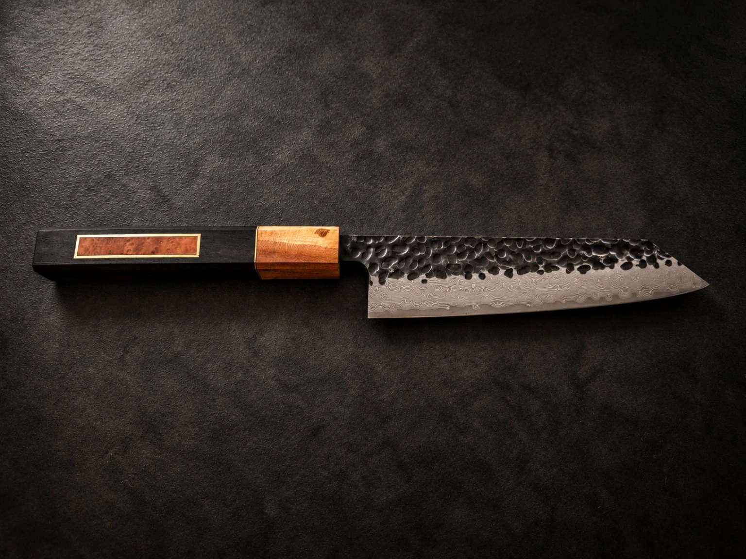Finished knife — ebony-toned handle with framed reddish burl inlay and contrasting ferrule