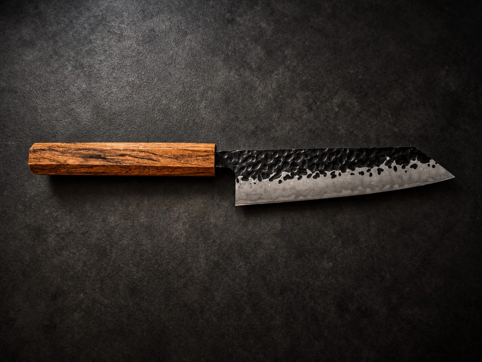 Finished knife — finely grained amber-brown wooden handle