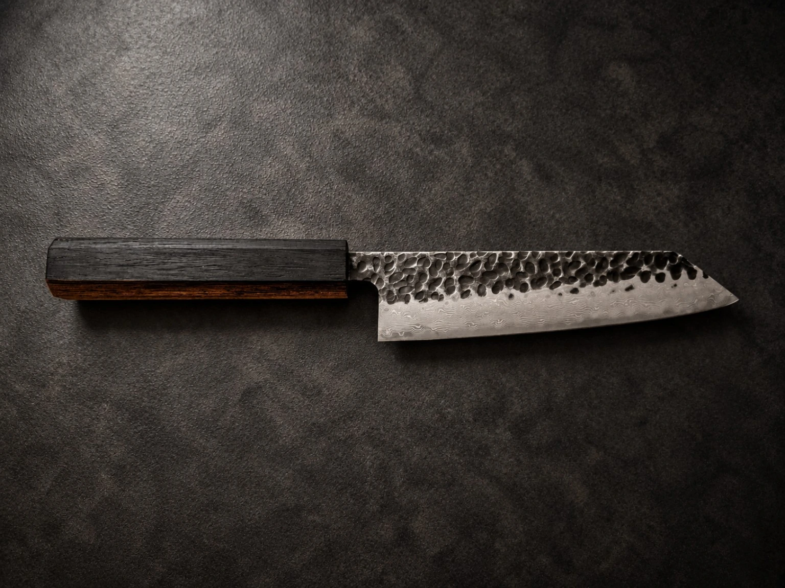 Finished knife — dark wood handle with a slim natural brown sapwood line